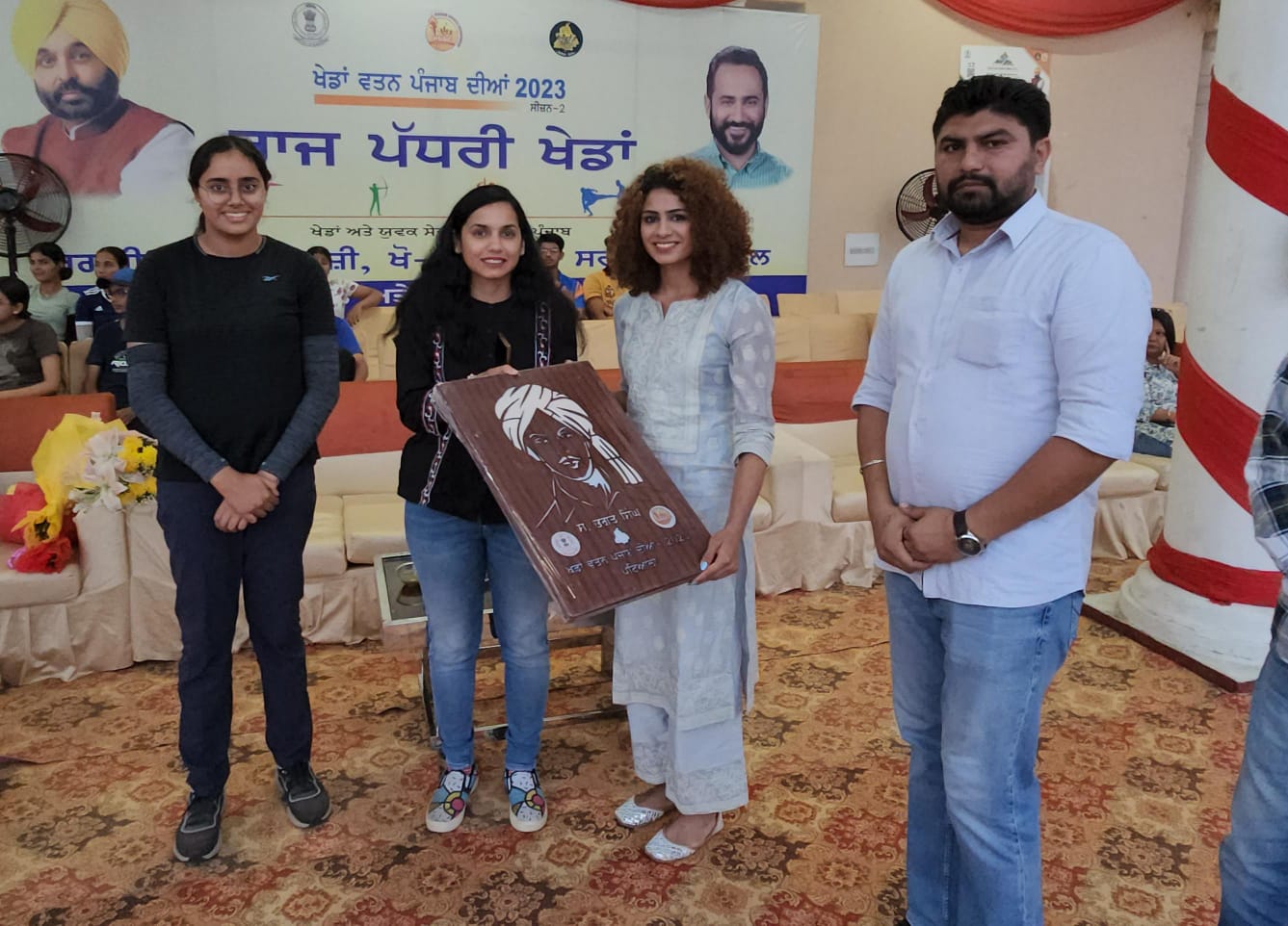 The Deputy Commissioner honored Asian medalists Harmilan Bains and Praneet Kaur