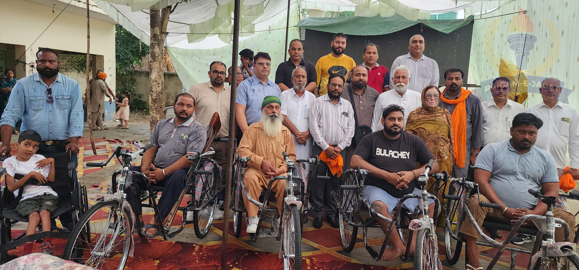 Raju Brothers Welfare Association Distributes Hundreds of Wheelchairs and Tricycles to Needy People Despite Heavy Rain